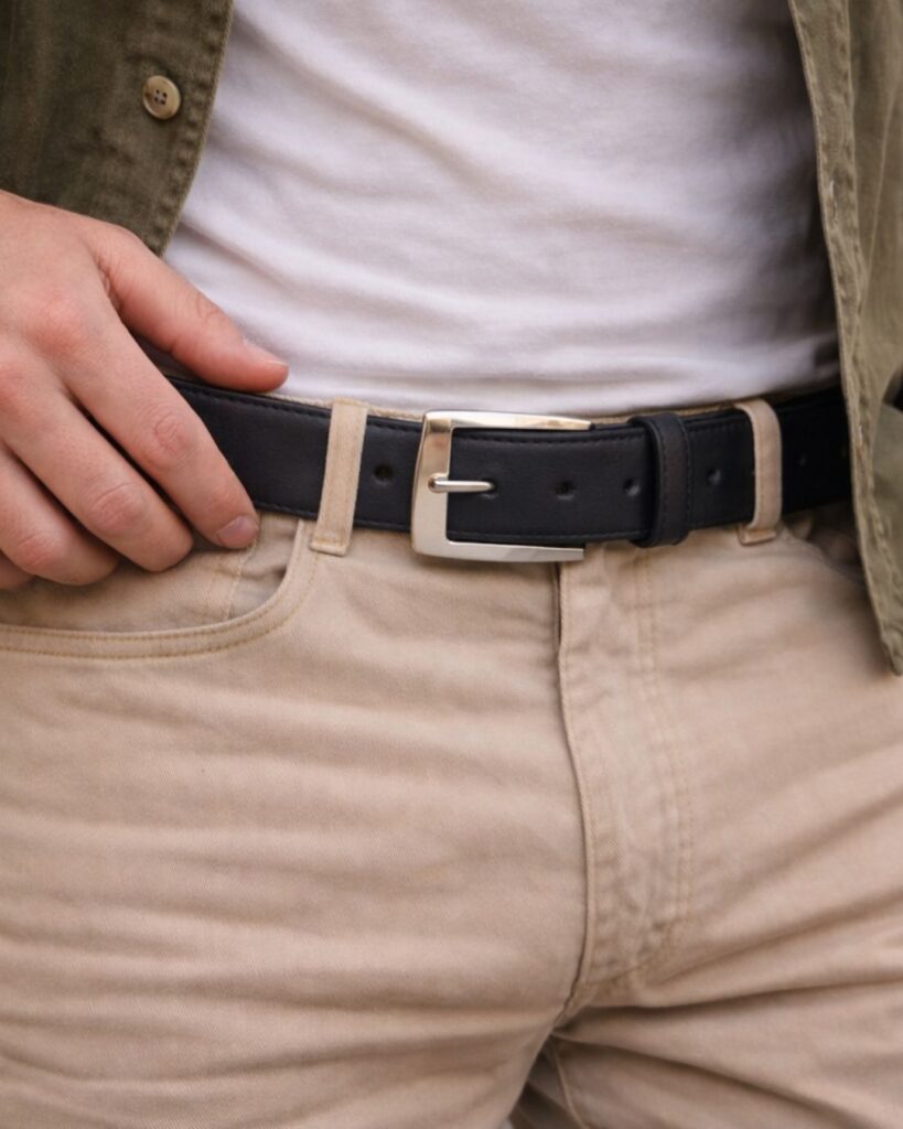 Man wearing a black plain leather belt with silver buckle handcrafted by Oasis Tanning Company South Africa